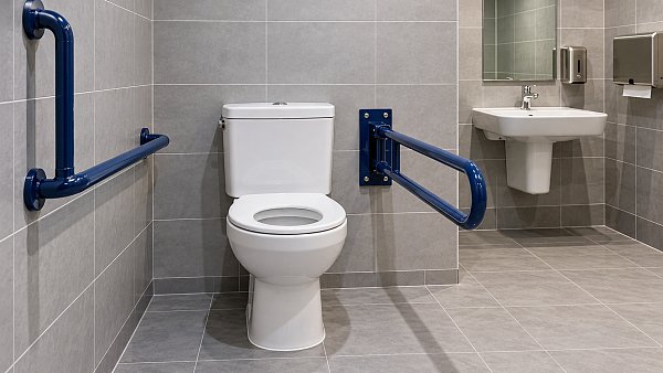Which UK accessibility standards apply to bathroom grab bars?