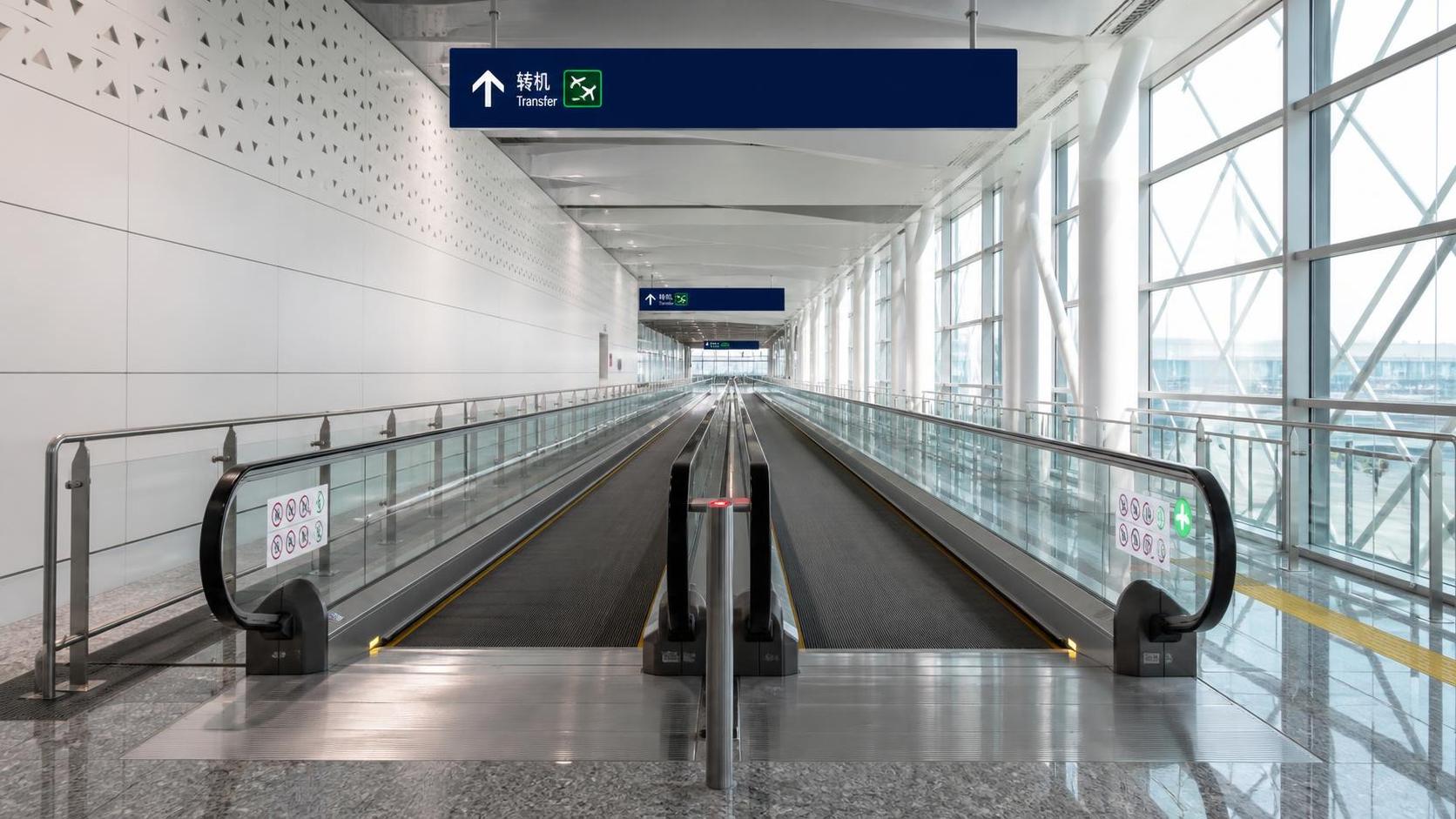 Are Destination-Dispatch Moving Walks Reliable Under Heavy Traffic?