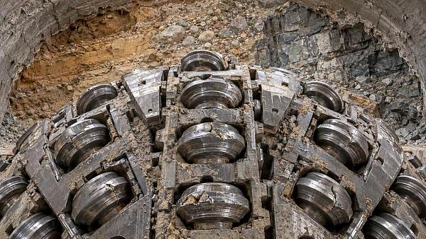Should TBM cutter replacement be scheduled by wear measurement or advance rate?