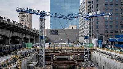 When do topless tower cranes for infrastructure make sense on tight sites
