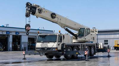 When does a truck-mounted cranes load moment indicator need recalibration