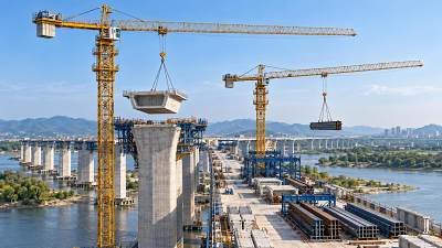 When do topless tower cranes make sense for bridge construction?