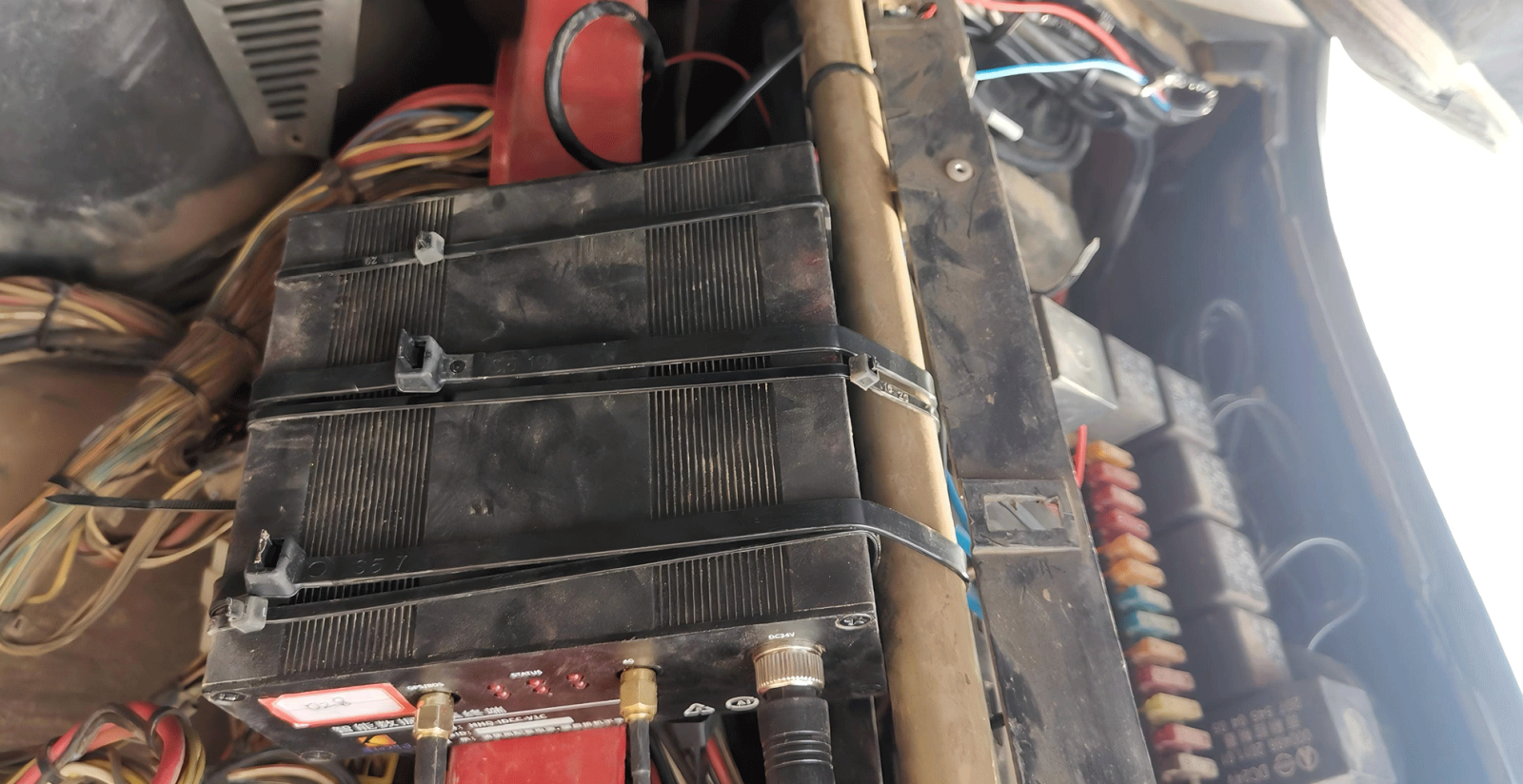 On-site professional installation of fuel management hardware, showcasing non-contact sensors and anti-theft lock systems on fuel tanks for maximum asset protection.