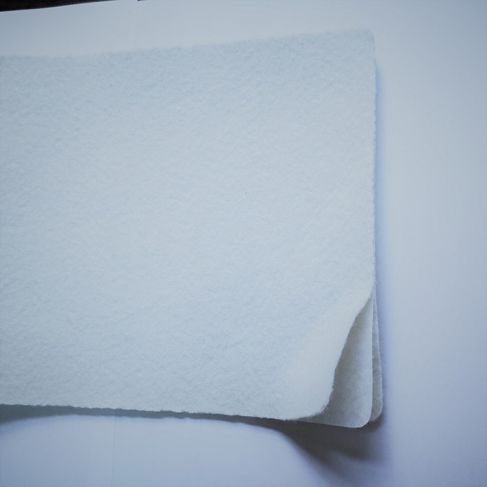 One membrane two geotextiles