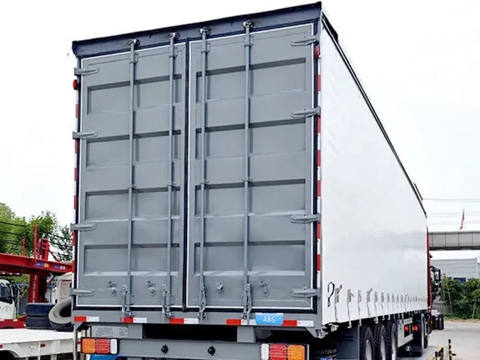Semi-remorque à rideaux latéraux en PVC pour conteneur maritime, à 3 essieux