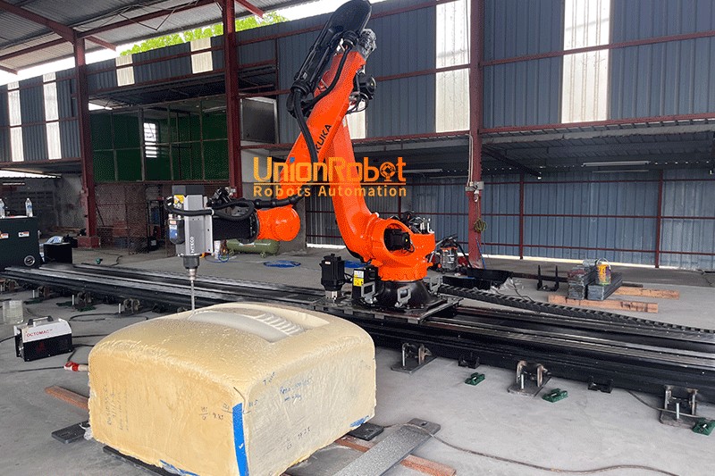 Engineer went to Malaysia to train customers to use robotic arm