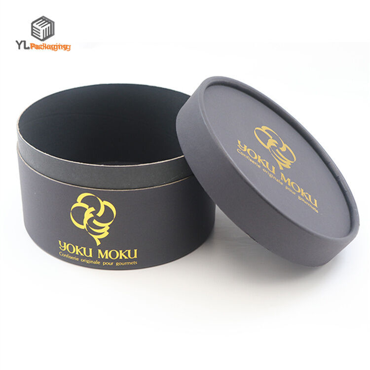 round cardboard boxes with lids open