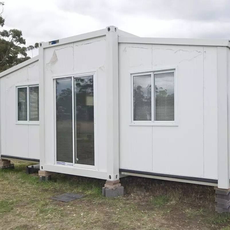 Double-wing extended container house vs. regular container house