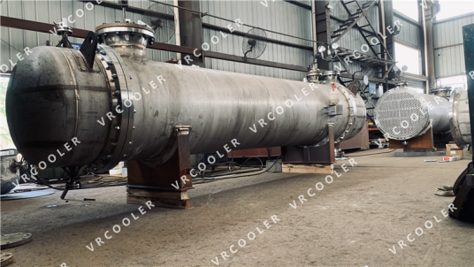What is the function of a shell-and-tube heat exchanger in a desalination plant?