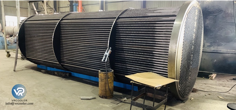 What material grades are commonly used on the seawater side of marine heat exchangers?