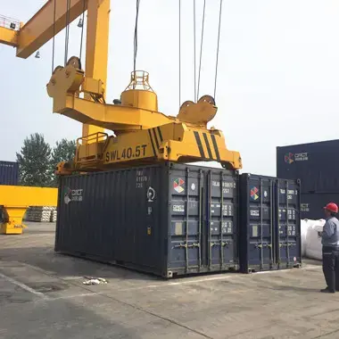 Rotary container spreaders