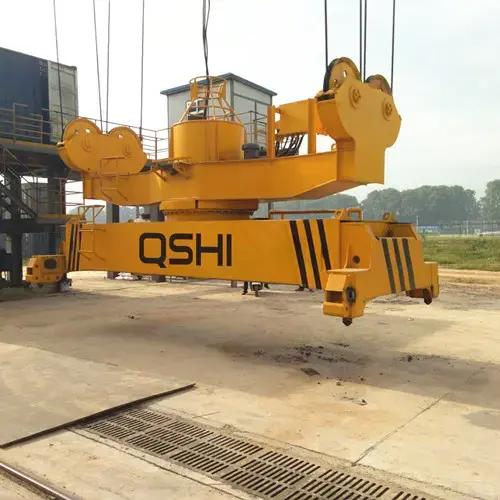 Rotary container spreaders
