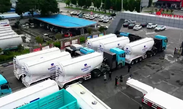 A large number of bulk cement tanker semi trailers are being shipped overseas