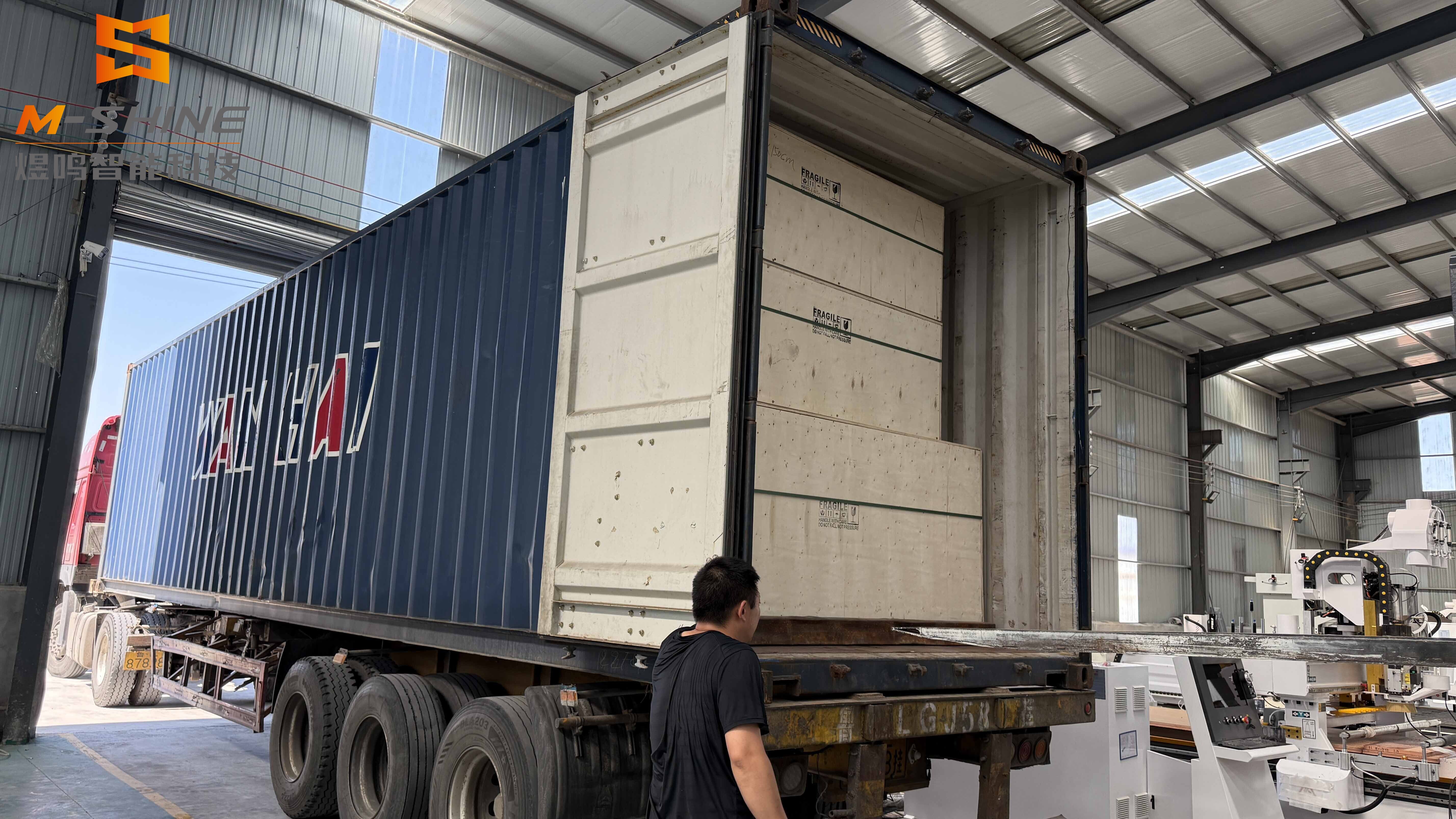 Multiple CNC wood carrying machines packaged and shipped to the UK