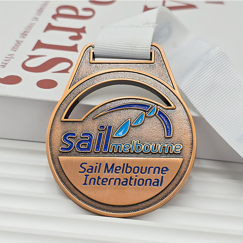 Vintage bronze metal medal, commemorative blue painted sailboat element for the Melbourne International Yacht Race, a collectible nautical event.