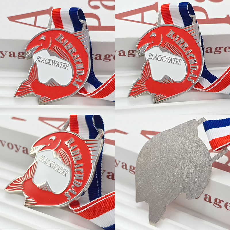 Silver and red color-blocked metal medal, commemorative fish-shaped openwork three-dimensional relief water sports collectible.