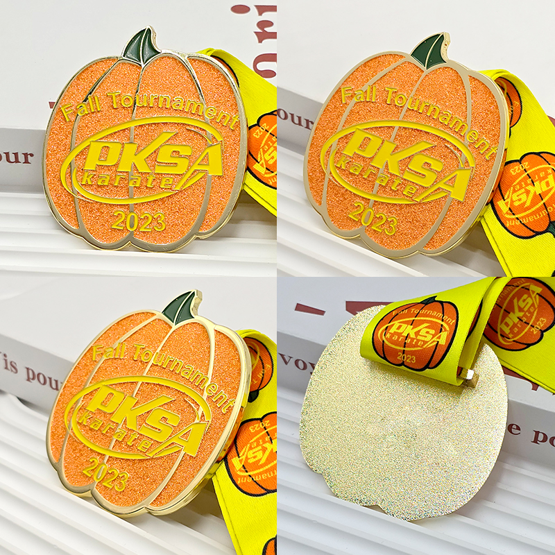 Orange and gold color-blocked pumpkin-shaped metal medal, commemorating the 2023 PKSA Karate Autumn Championships, Halloween-themed collectible item.