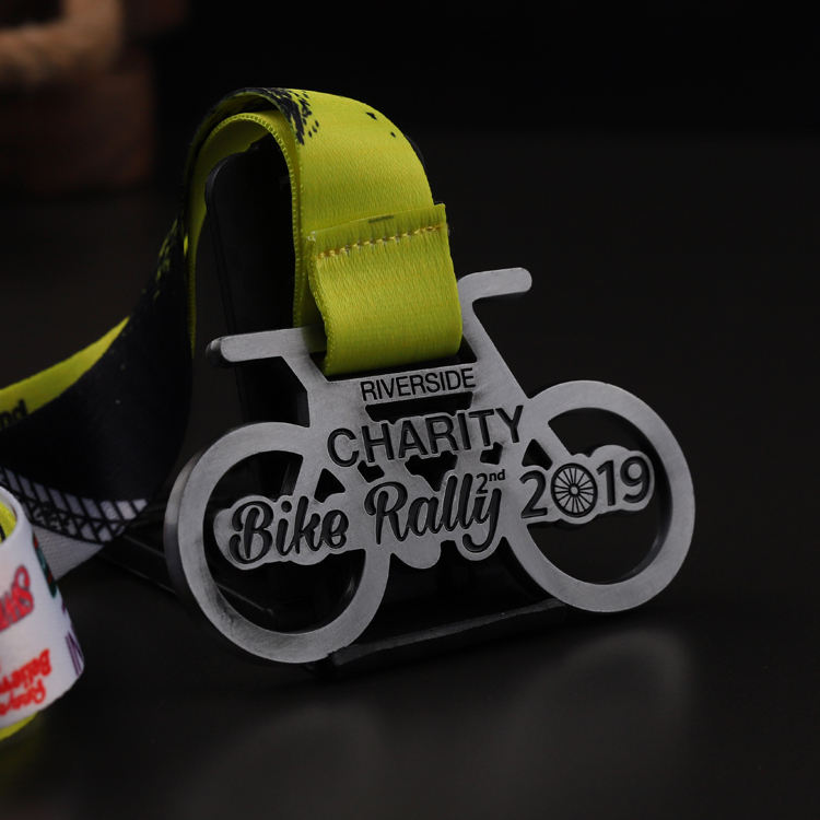 Charity bike rally medal, distressed silver openwork metal commemorative badge, cycling race charm.