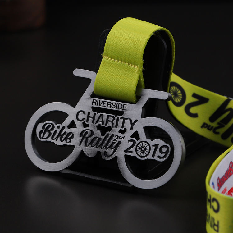 Charity bike rally medal, distressed silver openwork metal commemorative badge, cycling race charm.