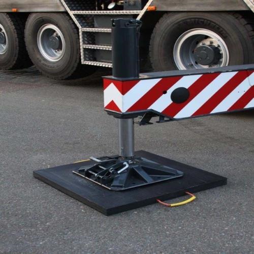 Durable and impact-resistant, polyethylene outrigger pads support large concrete pump trucks on construction sites