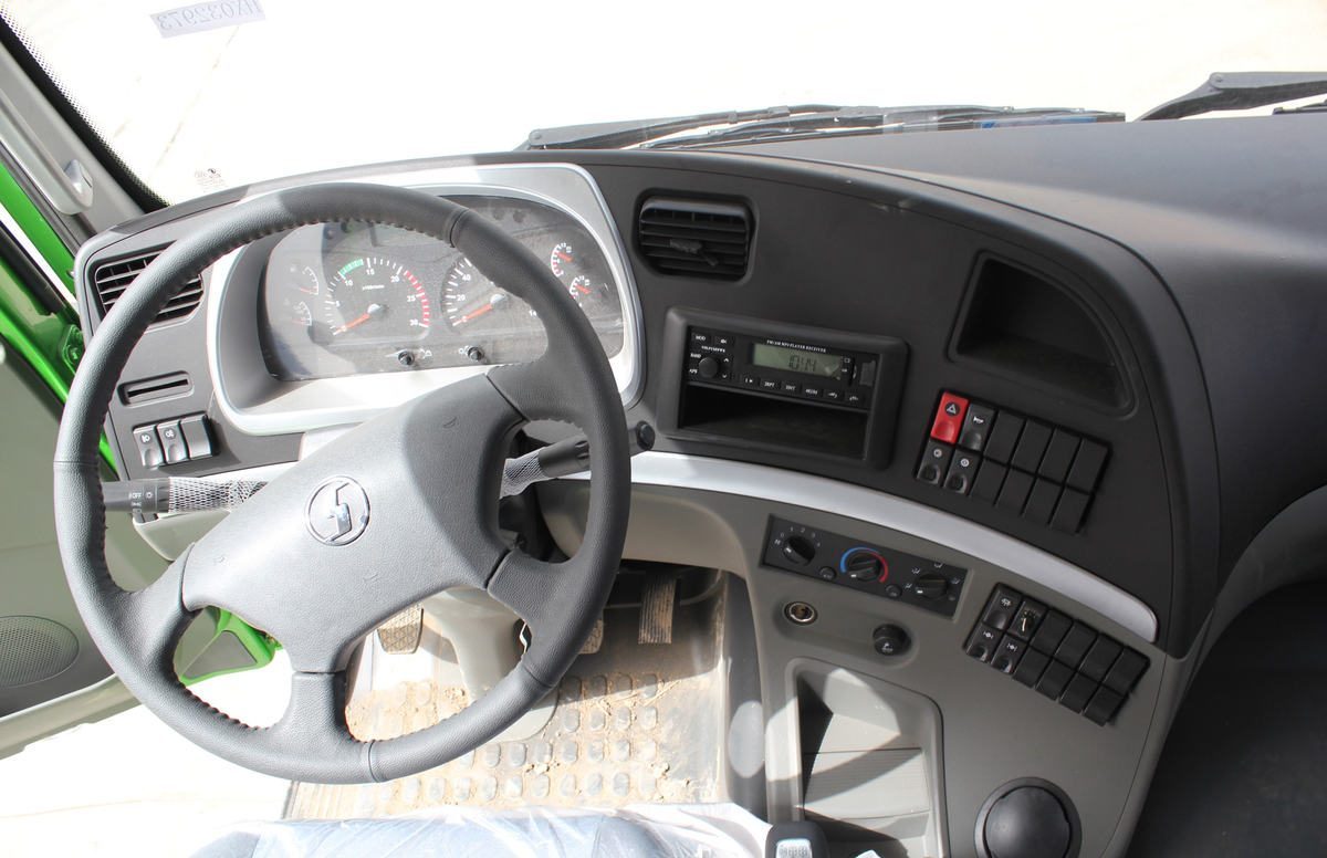 Shacman M3000 6x4 350HP dump truck steering wheel detail with instrument panel and controls Shacman M3000 6x4 350HP dump truck steering wheel detail with instrument panel and controls
