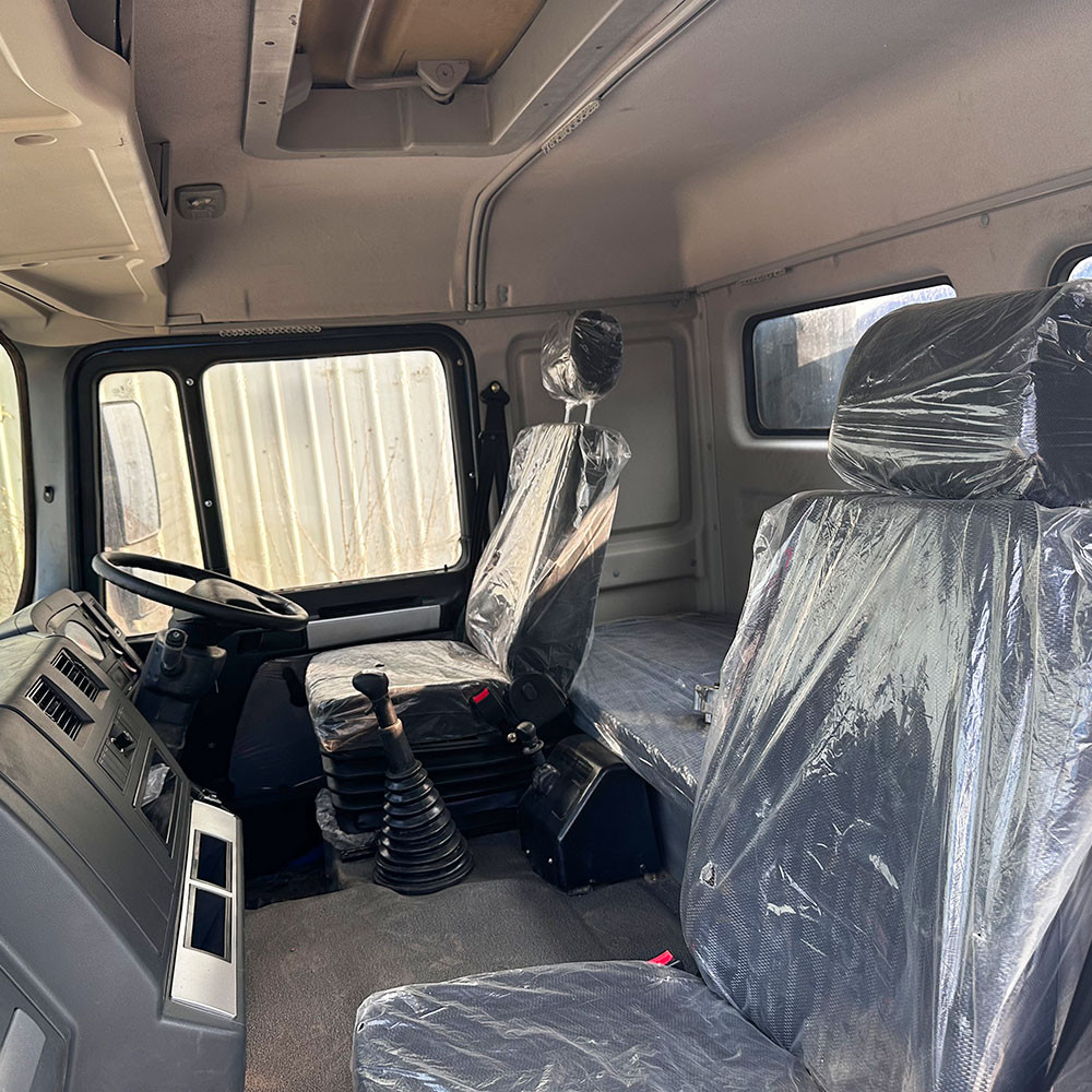 Shacman F3000 6x4 heavy duty water tanker truck cabin interior showing ergonomic layout and driver comfort Shacman F3000 6x4 heavy duty water tanker truck cabin interior showing ergonomic layout and driver comfort