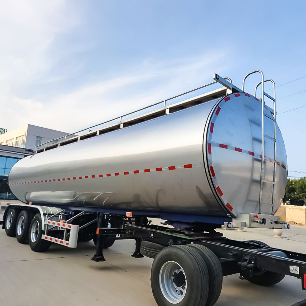 3 axle stainless steel milk tanker front three quarter view highlighting tank body and axle layout