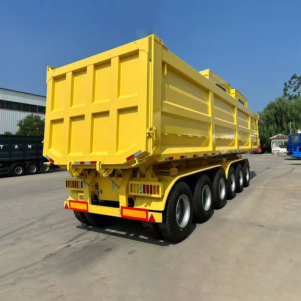 6 axle 40 ton dump semi trailer rear three quarter view showing discharge tailgate and heavy duty frame