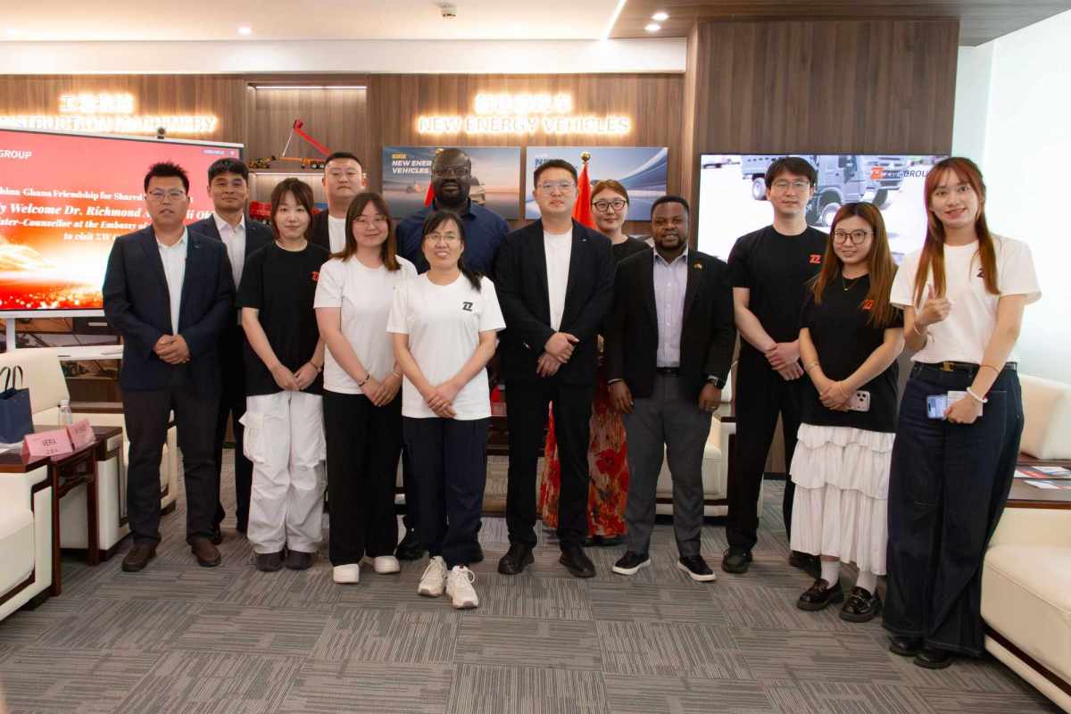 Ghana Embassy Minister-Counsellor Dr. Richmond Afotey Nii Okle posing with ZW Vehicle Group Chairman Yongchang Sun, General Manager Pierce Guo, and senior management team during official visit in Jinan, China 6