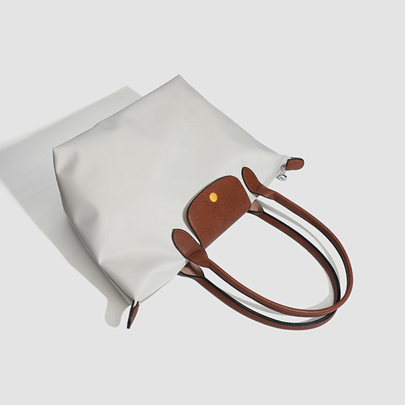 French Nylon Bag 2025 New Crossbody Bag Mommy Long Handle Tote Bag Women's Casual Commuter Single Shoulder Handheld Xiang Bag