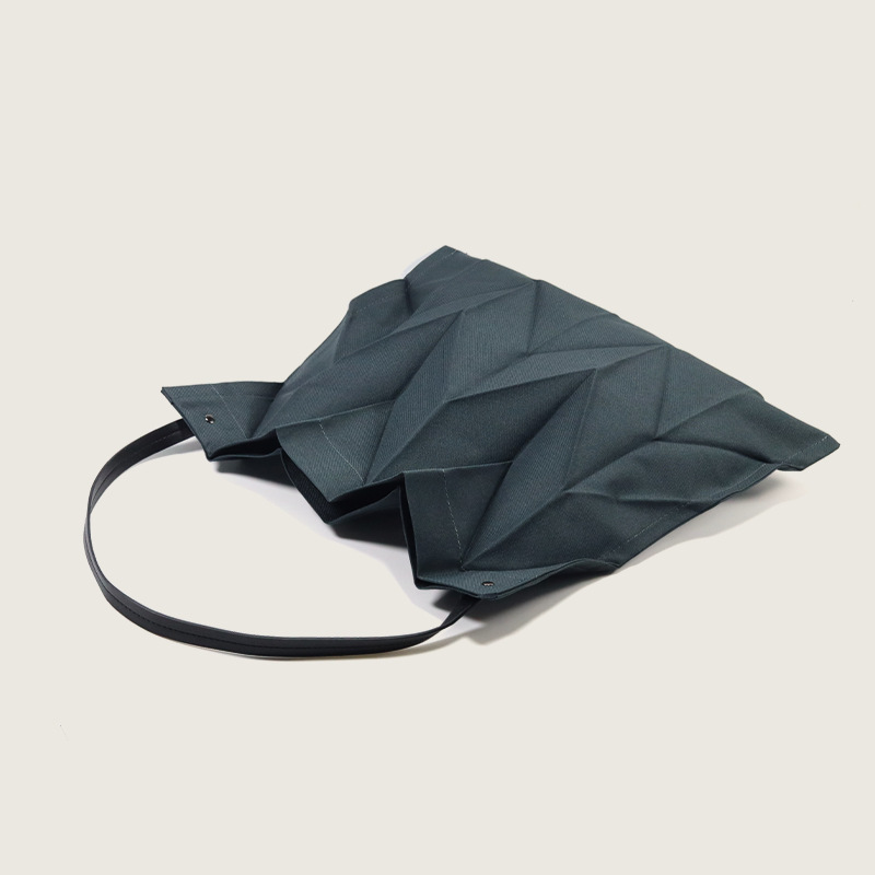 2025 Japanese and Korean pleated women's bag simple and lightweight folding canvas bag fashionable and artistic niche design hand-held shopping bag 2025 Japanese and Korean pleated women's bag simple and lightweight folding canvas bag fashionable and artistic niche design hand-held shopping bag