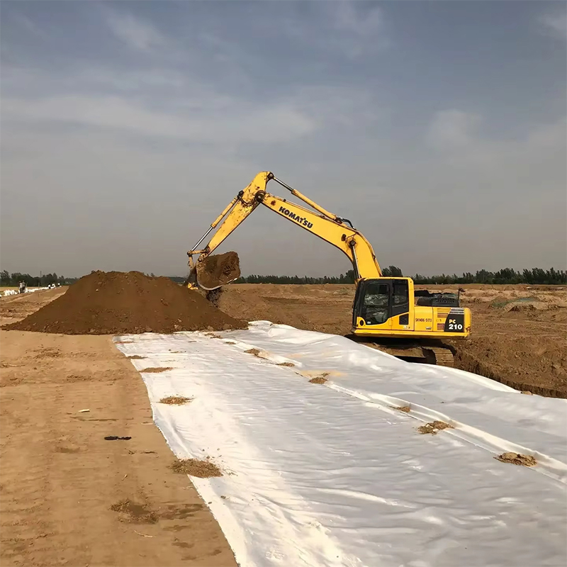 Long-filament woven geotextile
