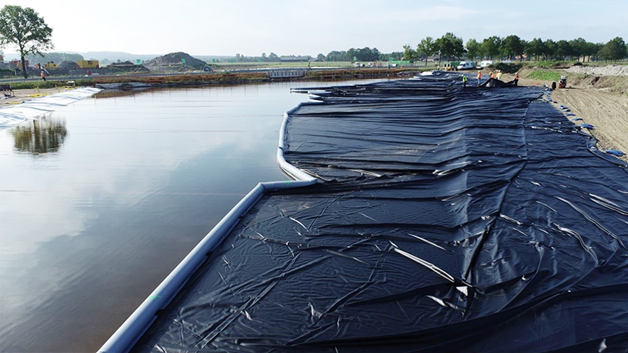 What are the functions of geomembranes in flood prevention?
