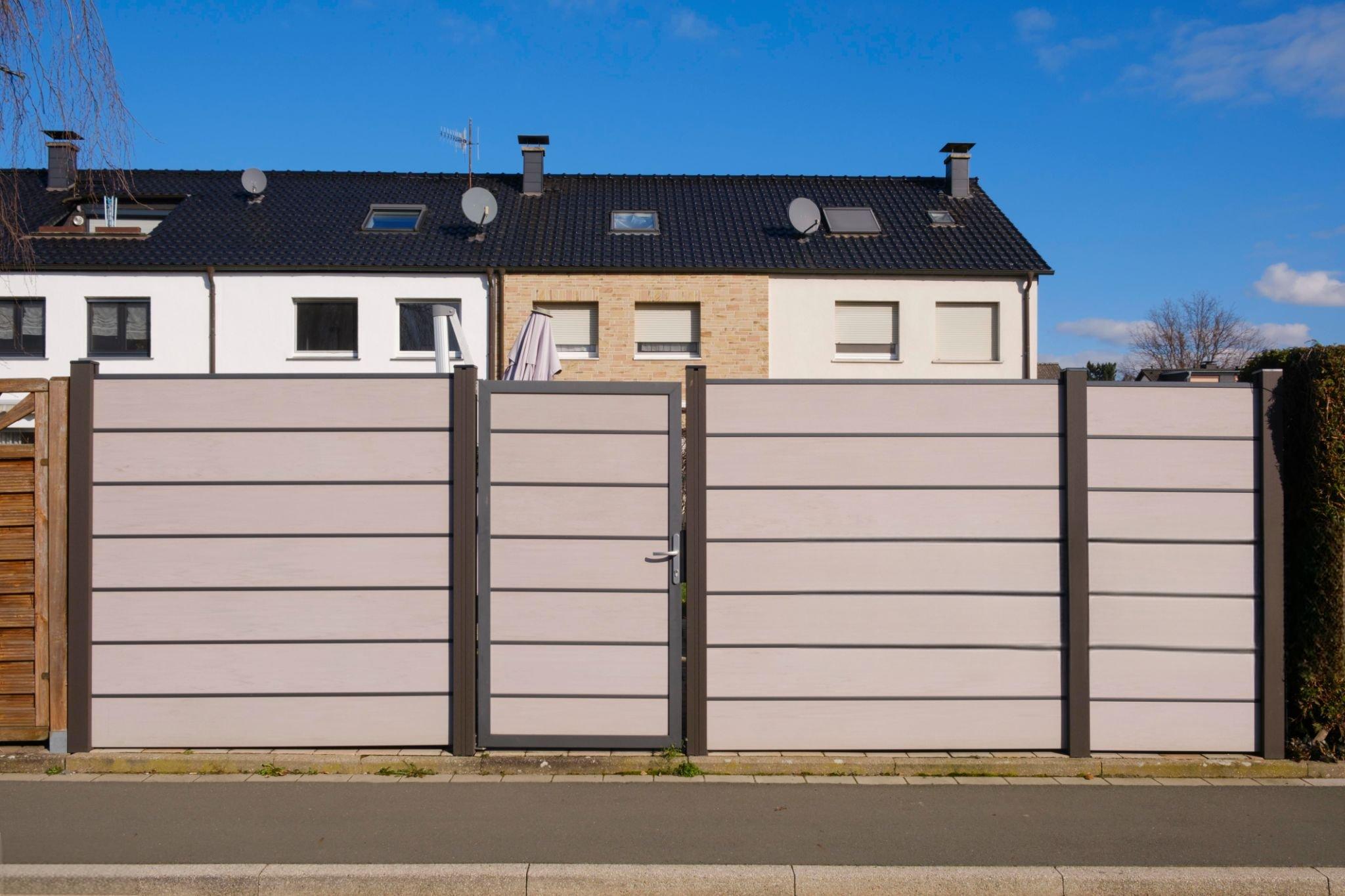 When should you specify powder-coated versus anodized finishes for aluminum privacy fence panels in urban infrastructure?