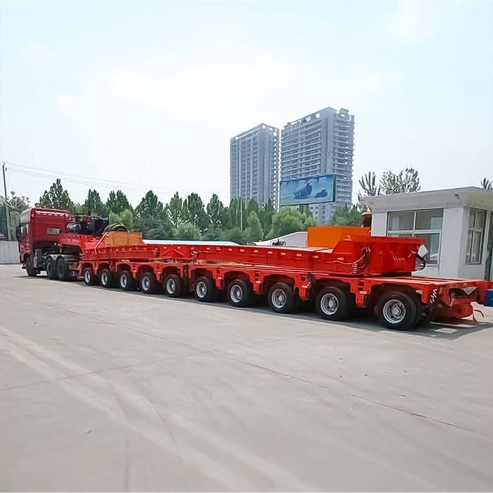 Nicolas modular platform trailer side view carrying heavy industrial equipment Nicolas Remorque Modulaire pour Équipements Lourds