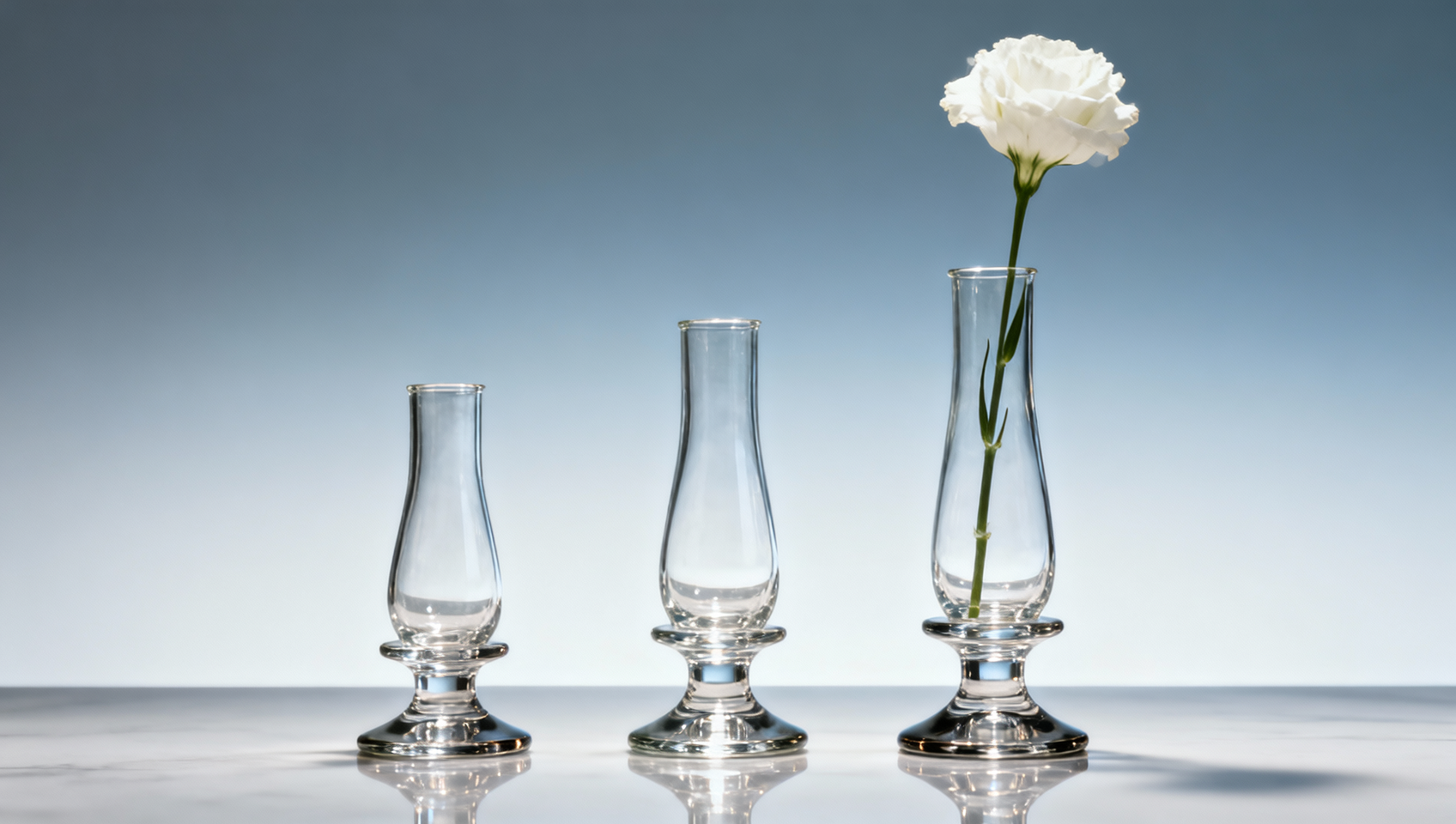 Glass bud vases tip over easily — center of gravity vs. base width trade-off Glass bud vases tip over easily — center of gravity vs. base width trade-off
