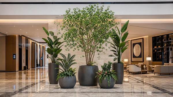 Artificial Plants for Hotels: How to Compare Fire Ratings, Materials, and Maintenance Needs