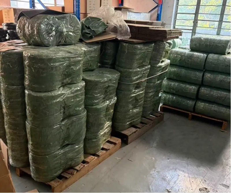 Wrapped drop cable coils stacked on wooden pallets for export packing Wrapped drop cable coils stacked on wooden pallets for export packing
