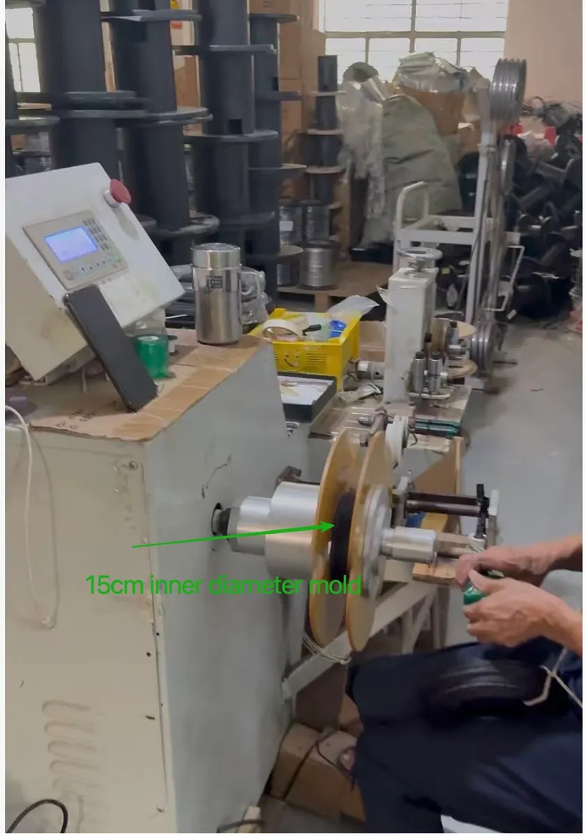 LinkFiber drop cable winding station using a 15 cm inner-diameter mold for initial coil packing LinkFiber drop cable winding station using a 15 cm inner-diameter mold for initial coil packing