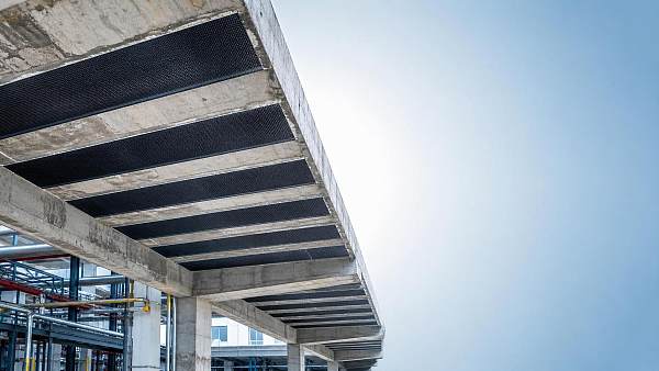 Carbon-Fiber Reinforcement for Slabs: When CFRP Wraps Beat Full Replacement