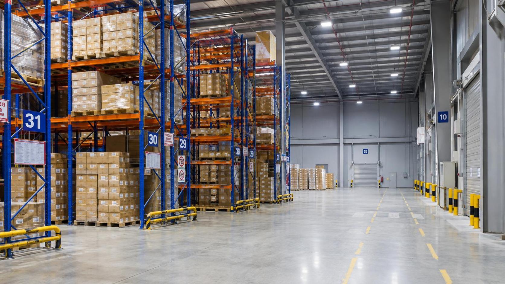 What lighting levels should guide warehouse lighting system selection?