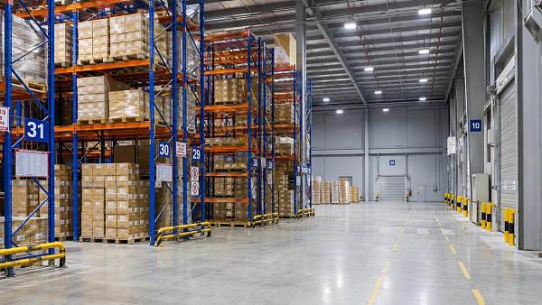 What lighting levels should guide warehouse lighting system selection?