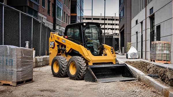 When does a skid steer make sense for tight space construction?