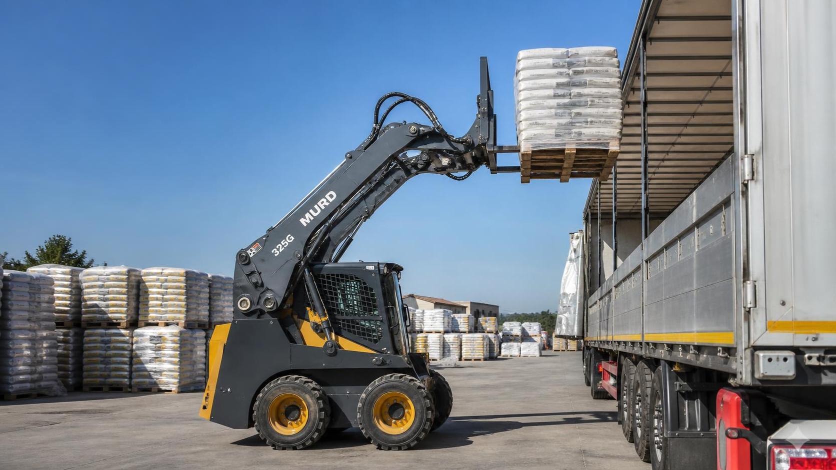 When does vertical lift make more sense in a skid steer loader?